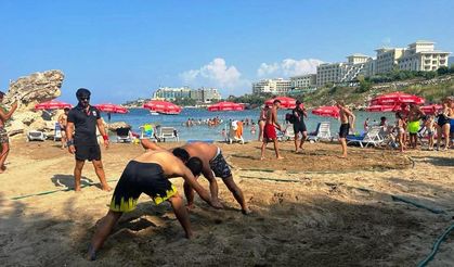 Güreşçiler kumda kozlarını paylaşacak